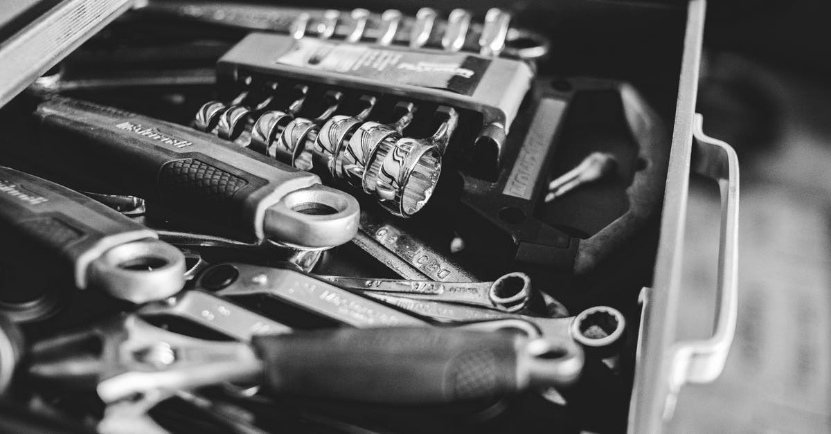 Combining whetstones from different manufacturers - From above black and white cabinet drawer with assorted repair tools in craftsmanship