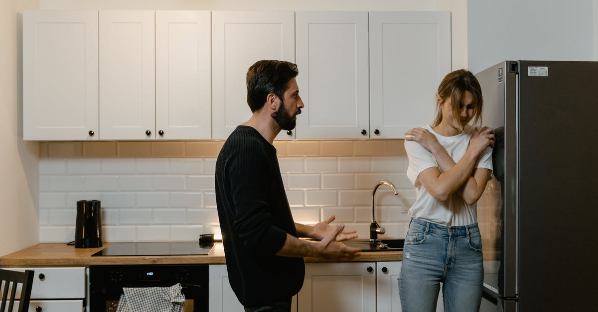 Commercial fridge for thawing - Man and Woman Having a Quarrel at the Kitchen 