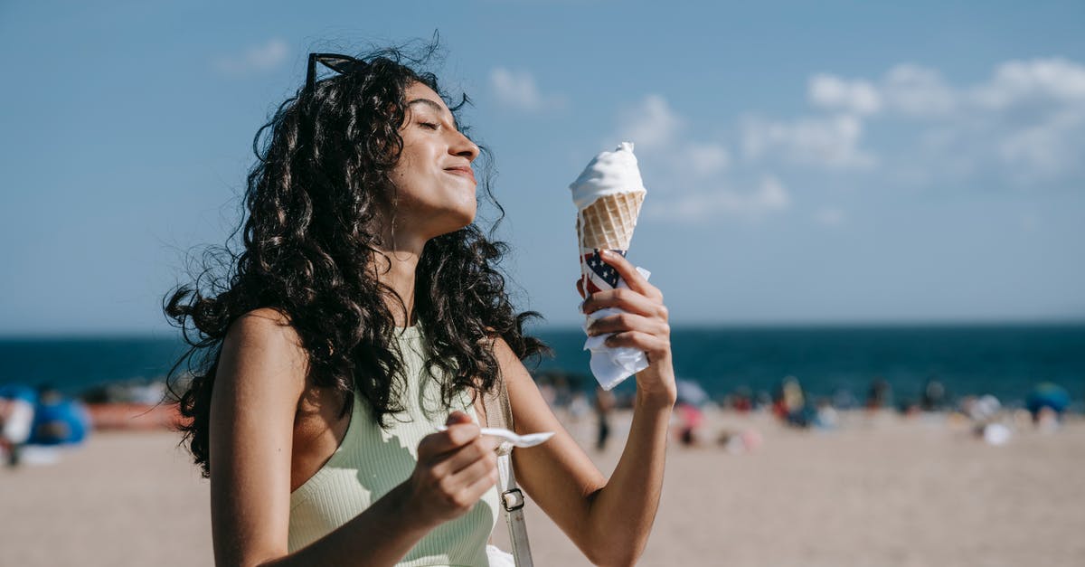 Contamination implications of eating peanut butter with a spoon - Woman Eating Vanilla Ice Cream