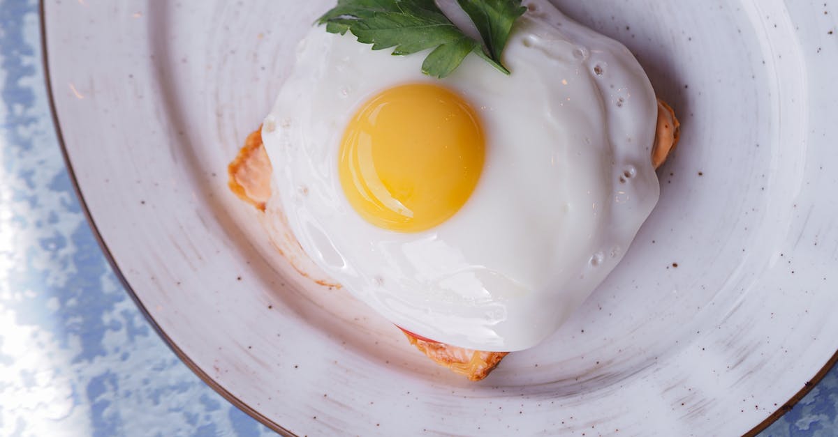 Converting between Egg sizes - Egg on White Ceramic Plate