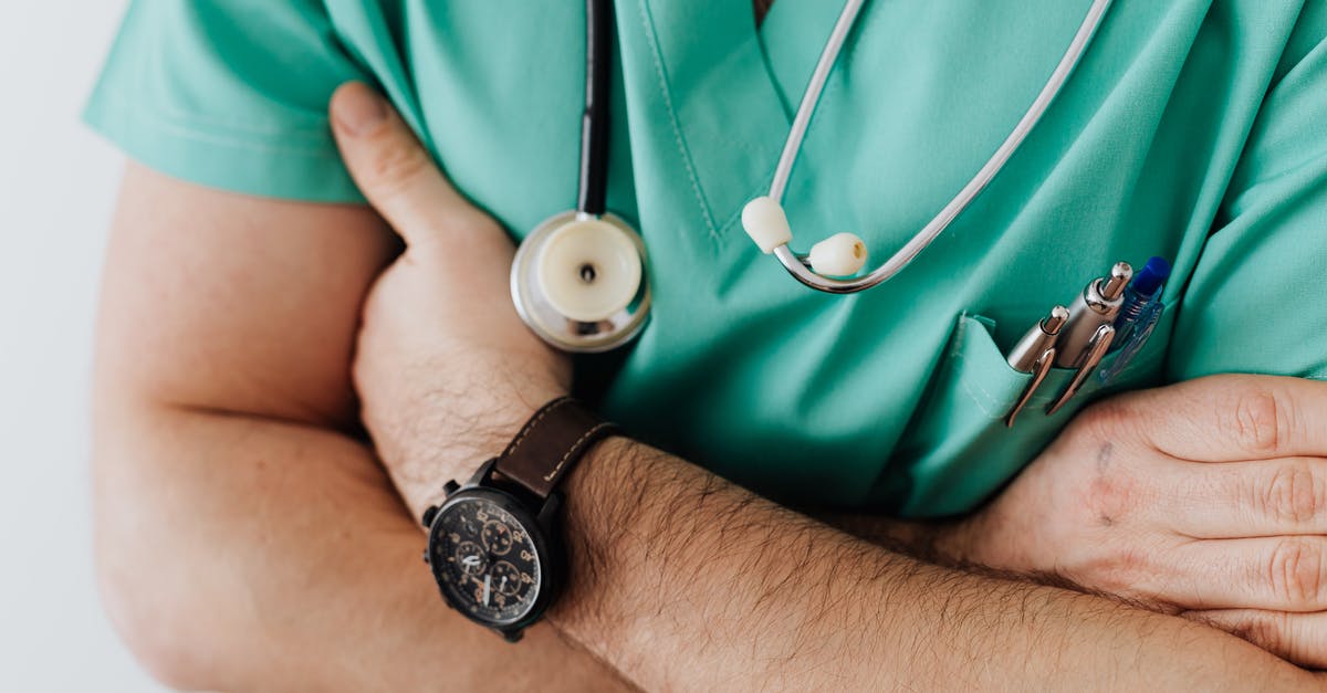 Converting stand mixing time to hand mixing - Crop doctor with stethoscope in hospital