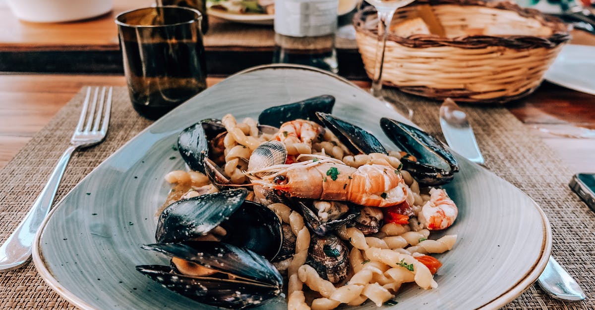 Cooked or Raw - Shrimp peeling - Cooked Shrimp and seashell dish