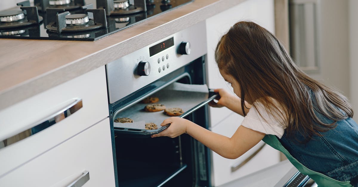 Cookies rise nicely in the oven, but then collapse - Photo of Girl Baking Cookies