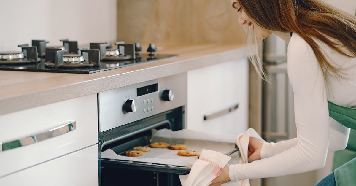 Cookies rise nicely in the oven, but then collapse - Photo of Woman Baking Cookies