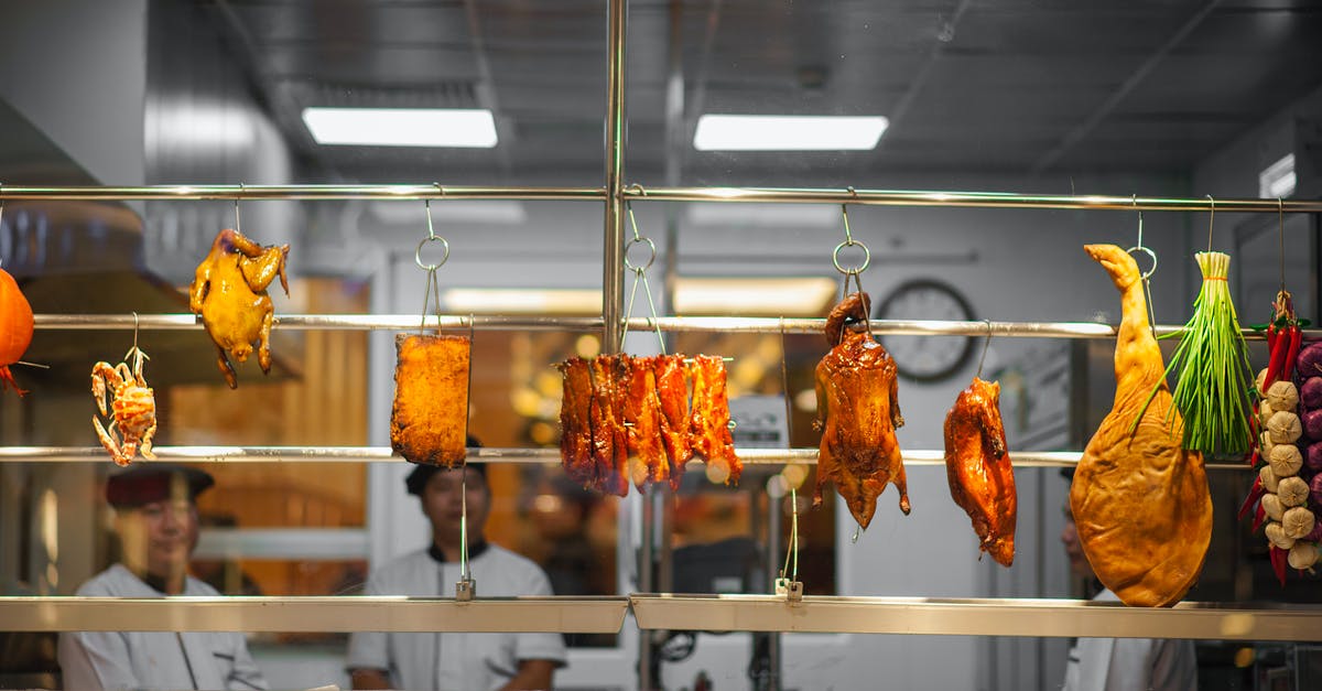 Cooking a Turkey crown - Photo of Assorted Food Hanging on Gray Metal Railings