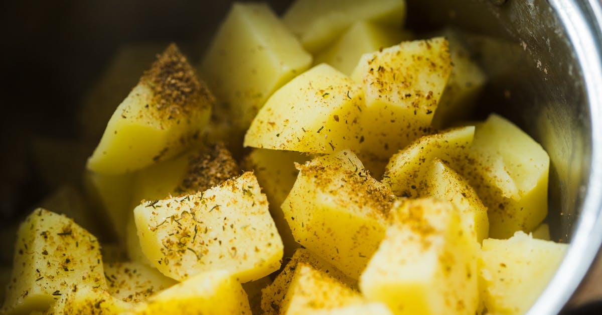 Cooking baked potatoes - Slice Potatoes on a Cooking Pot