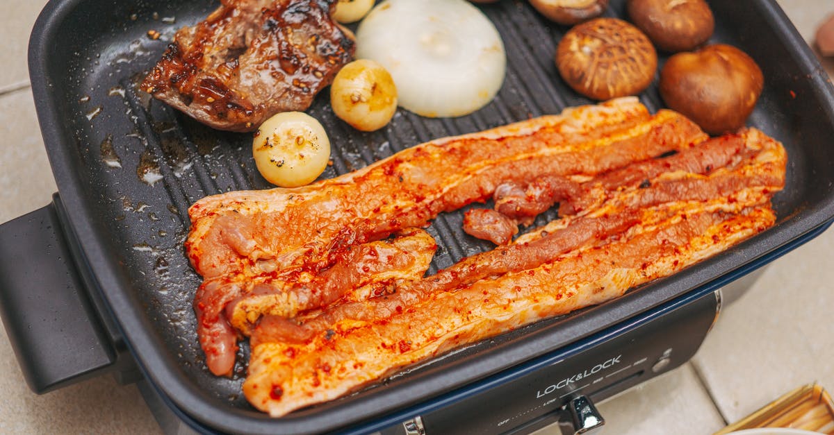 Cooking Chicken in Cooker Versus Pan? - Strips of Pork and a Piece of Chicken on Electric Griller with Onions and Mushrooms