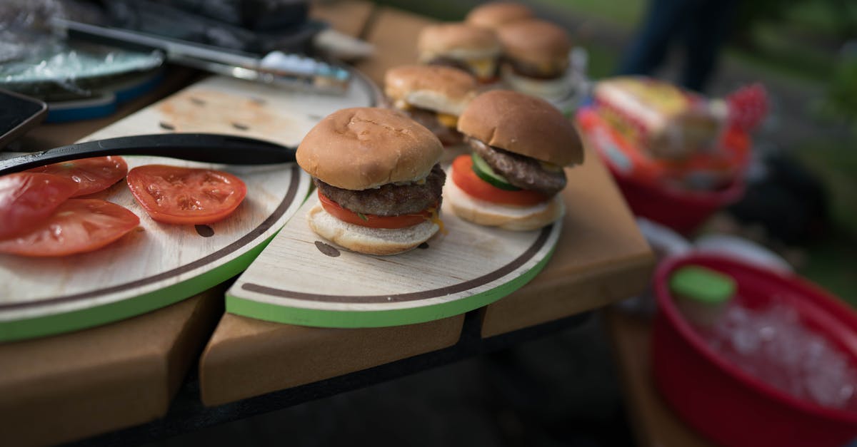 Cooking different meats on George Foreman grill - Delicious hamburgers with beef and juicy tomato