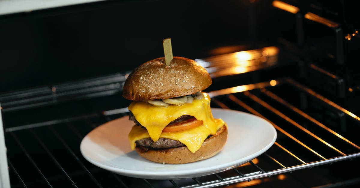 Cooking food directly on oven rack - Appetizing burger in hot oven