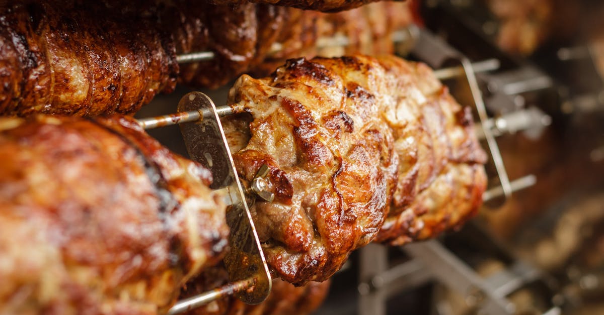 Cooking juicy beef in a pan - Grilled Meats