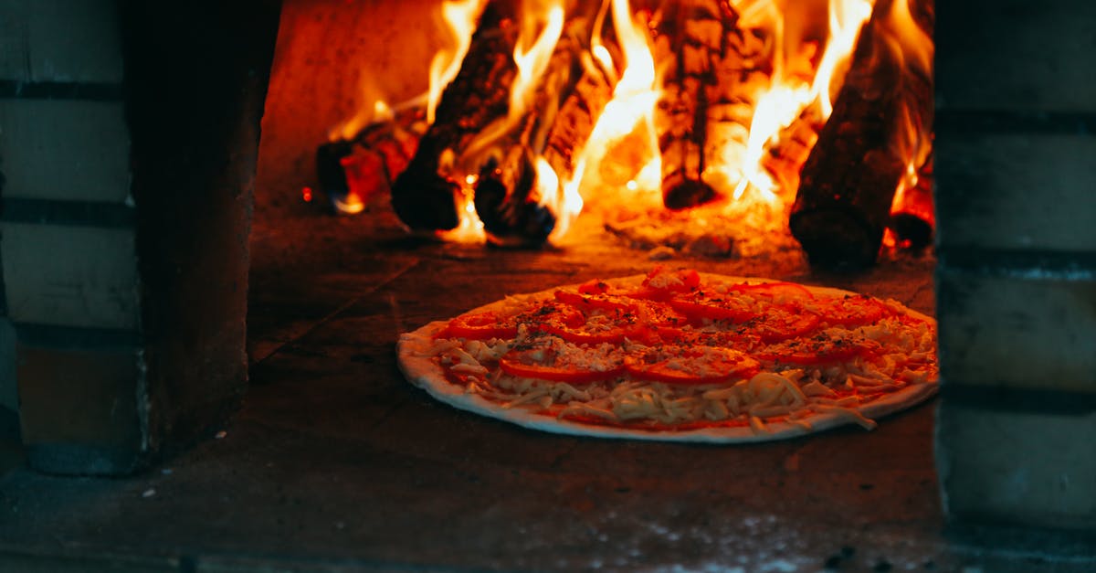 Cooking pizza in tiny gas oven with pizza stone - Pizza In Oven