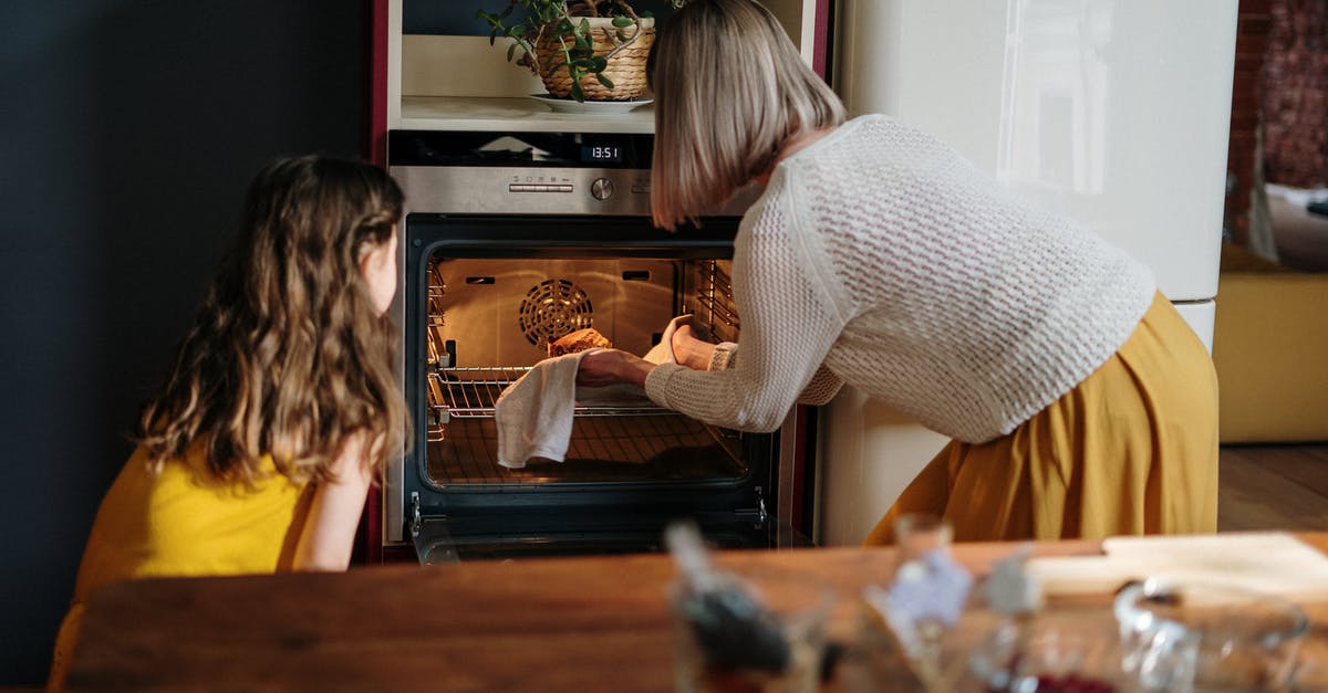 Cooking Porridge in steam oven - Woman in White Sweater Baking Cake