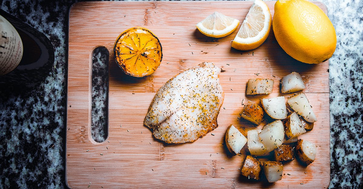 Cooking Potatoes - Sliced Lemon on Board