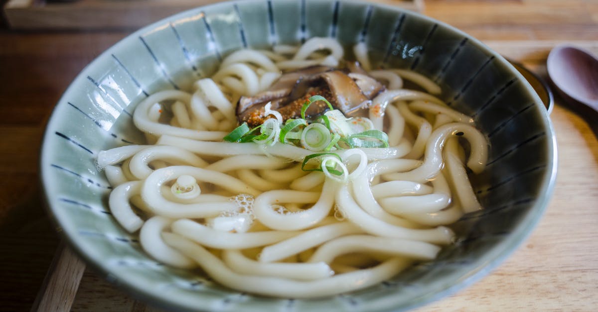 Cooking Ramen noodles in broth or not? - Broth with Pasta in Ceramic Bowl