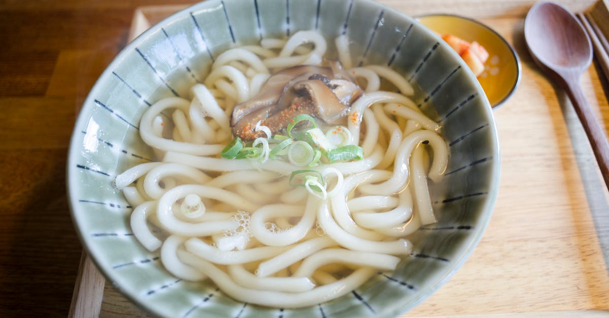 Cooking Ramen noodles in broth or not? - Soup with Pasta and Mushrooms in Ceramic Bowl