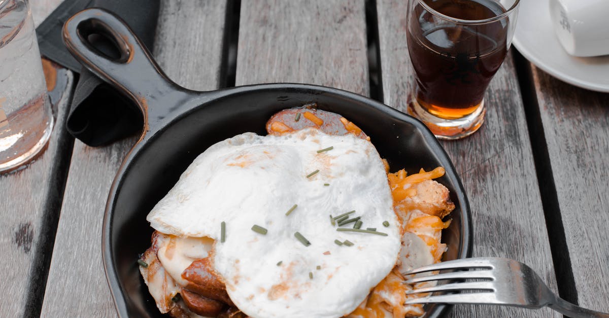 Cooking Scrambled Eggs ends up with excess liquid - Cooked Eggs and Meat on Cast-iron Pan