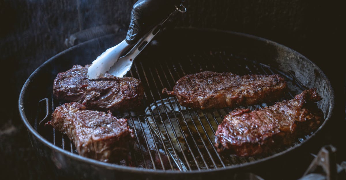 Cooking steak on the grill - Meat on a Griller