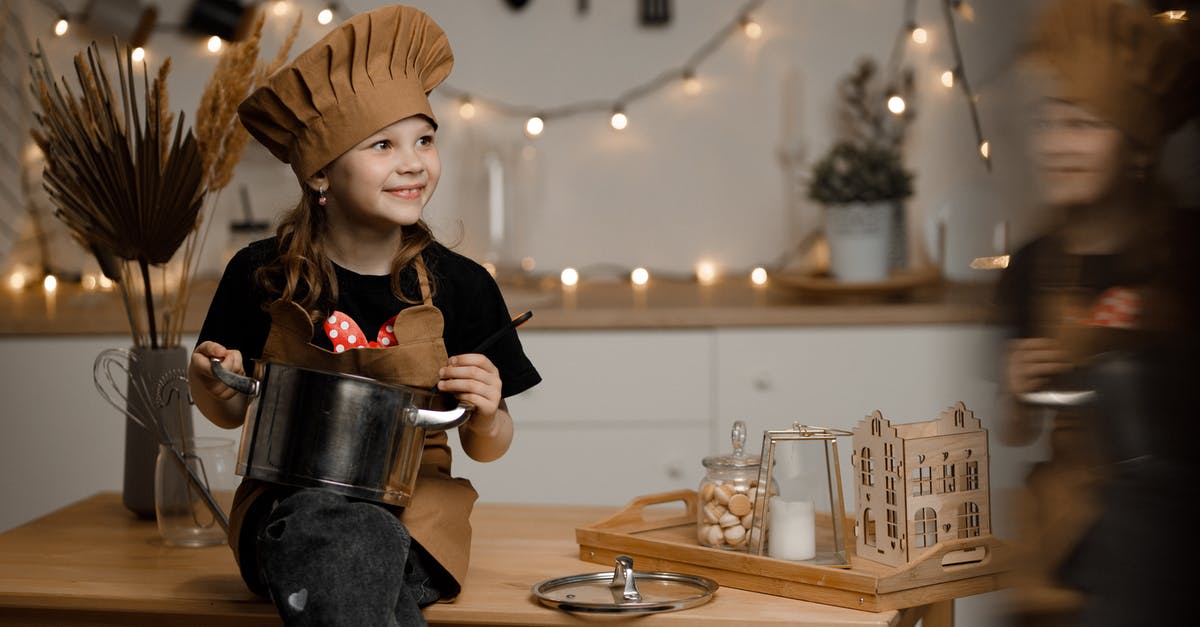 Cooking with a crock pot - temp - Little Girl Dressed as a Chef Sitting on a Kitchen Counter Holding a Pot and a Soup Spoon 