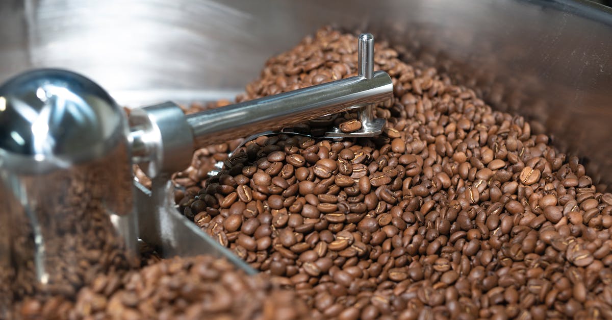 Cooling a Roast cooked in a Crockpot - Brown Coffee Beans on Stainless Steel Round Tray