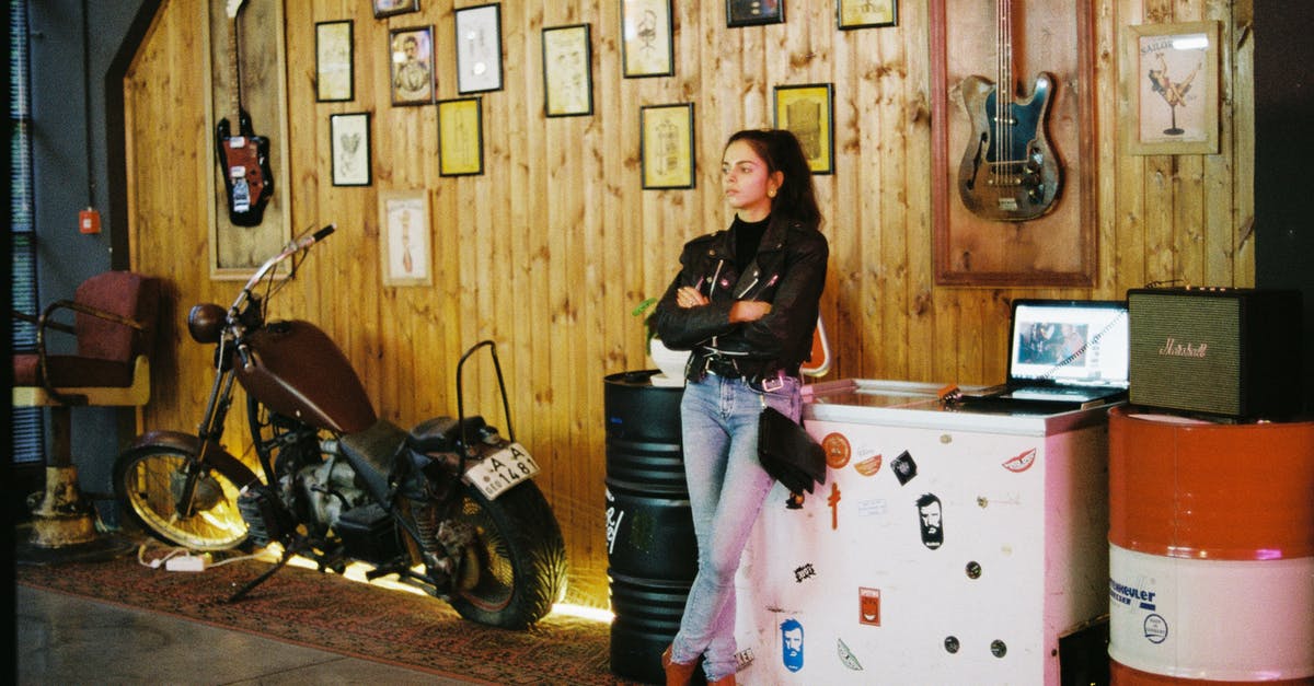 Cooling gelatin without a refrigerator - Young attractive woman in stylish cafe with retro motorbike