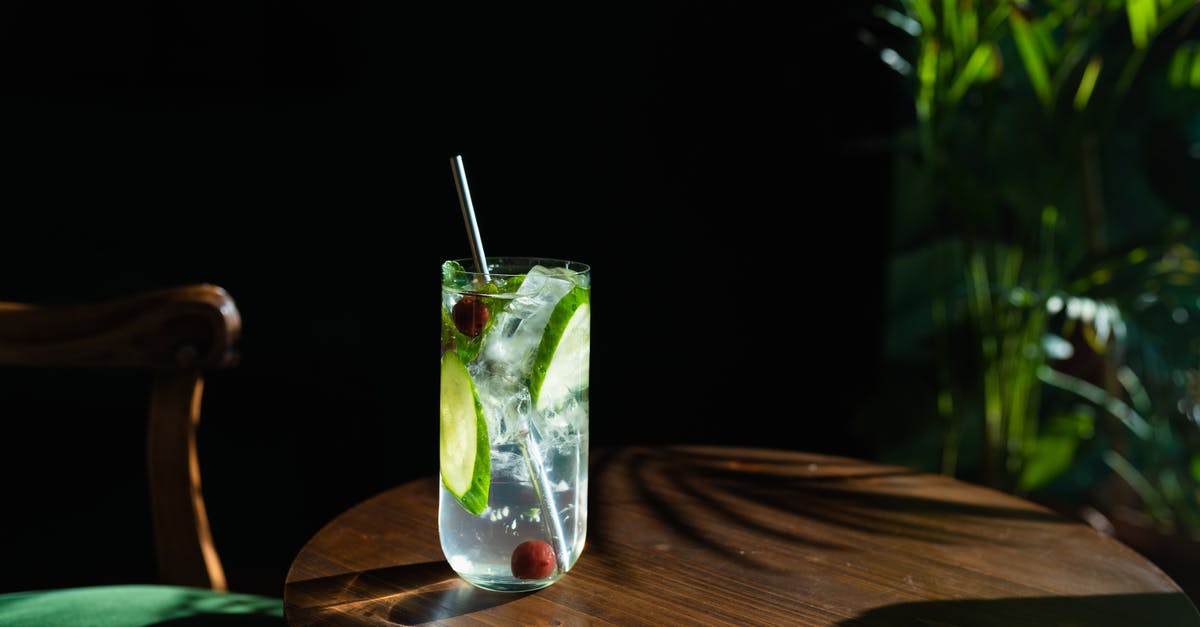 Copycat Lime Jello? - Clear Drinking Glass with Clear Liquid and Sliced Lime