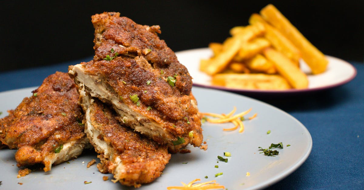 cornmeal crust on chicken is too gritty, is there a way to fix after chx has been baked? - Plates with deep fried meat and french fries