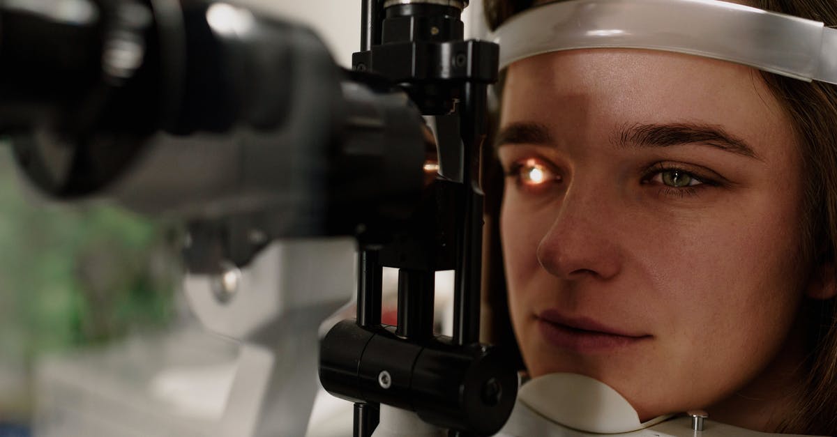 Correct procedure to thaw frozen pizza dough? - Serious female patient looking at light from contemporary ophthalmic bio microscope while getting eyesight examination in modern clinic during check up