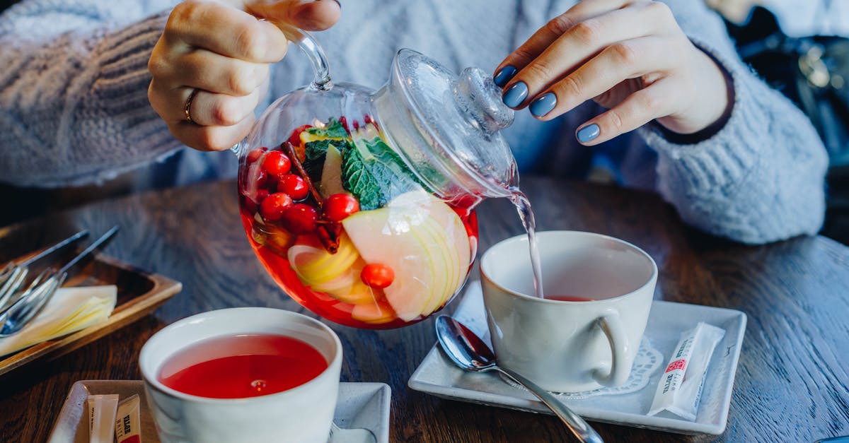 Could all types of filling be used as macaron filling? - Woman Filling Tea in Cup on Table