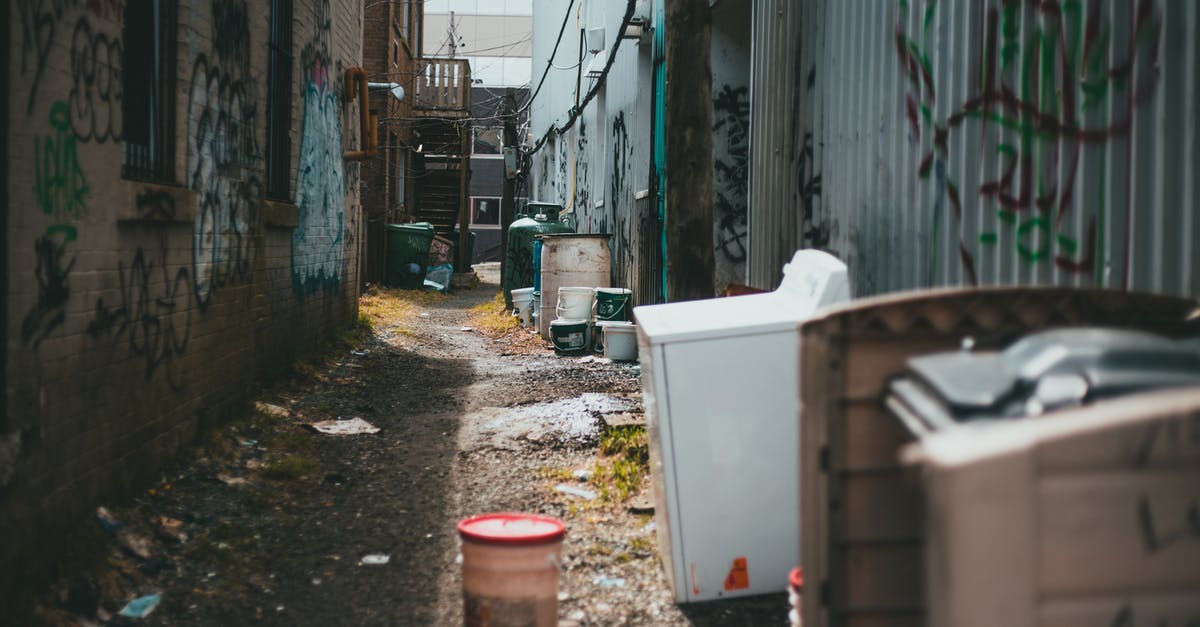 Could plastic or metal cans damage my oven? - Empty street with trash on ground