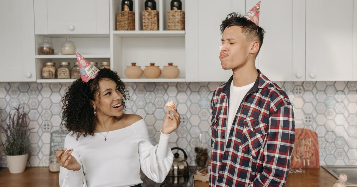 Cream cheese cupcake icing too sour - Man in Red and Black Plaid Dress Shirt Beside Woman in White Long Sleeve Shirt