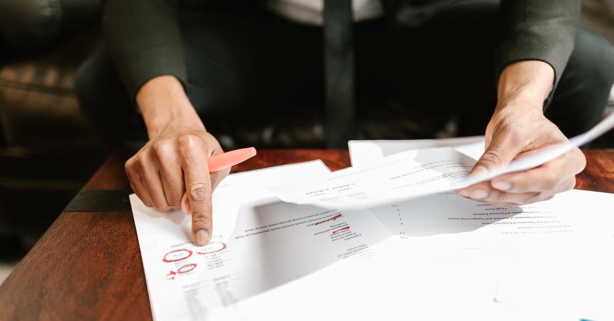 Creamer returns - Close-up Photo of Person pointing on Documents 