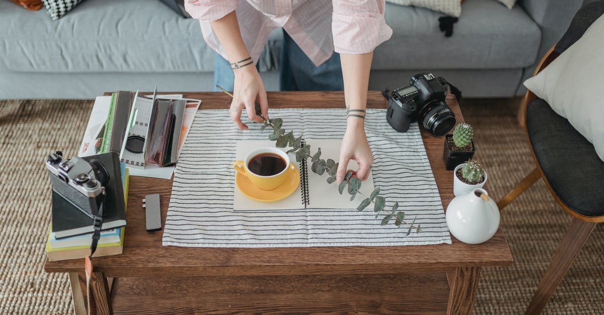 Create hot "sauce" from capsaicin extract - Crop faceless woman arranging coffee and twig on table