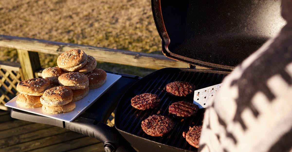 Creating high-protein food for hiking - Crop woman grilling meat for burgers outdoors