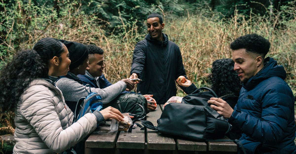 Creating high-protein food for hiking - Friends Sharing Snacks to Each Other