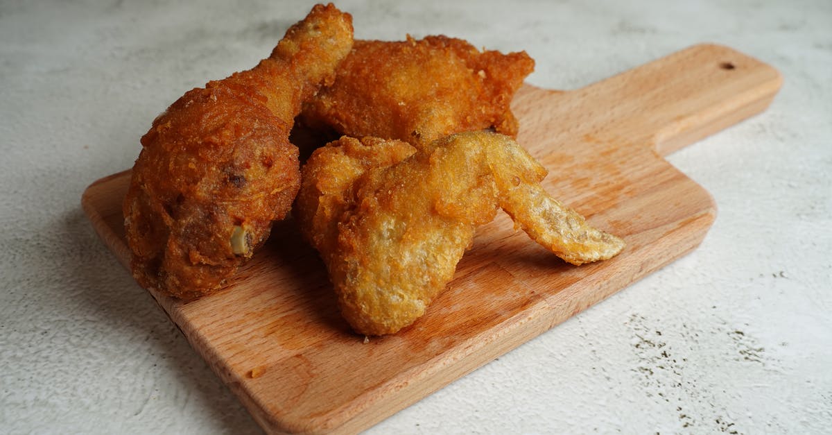 Crispy fried chicken goes limp: picnic disaster - Salami with onion rings and nuggets near french fries