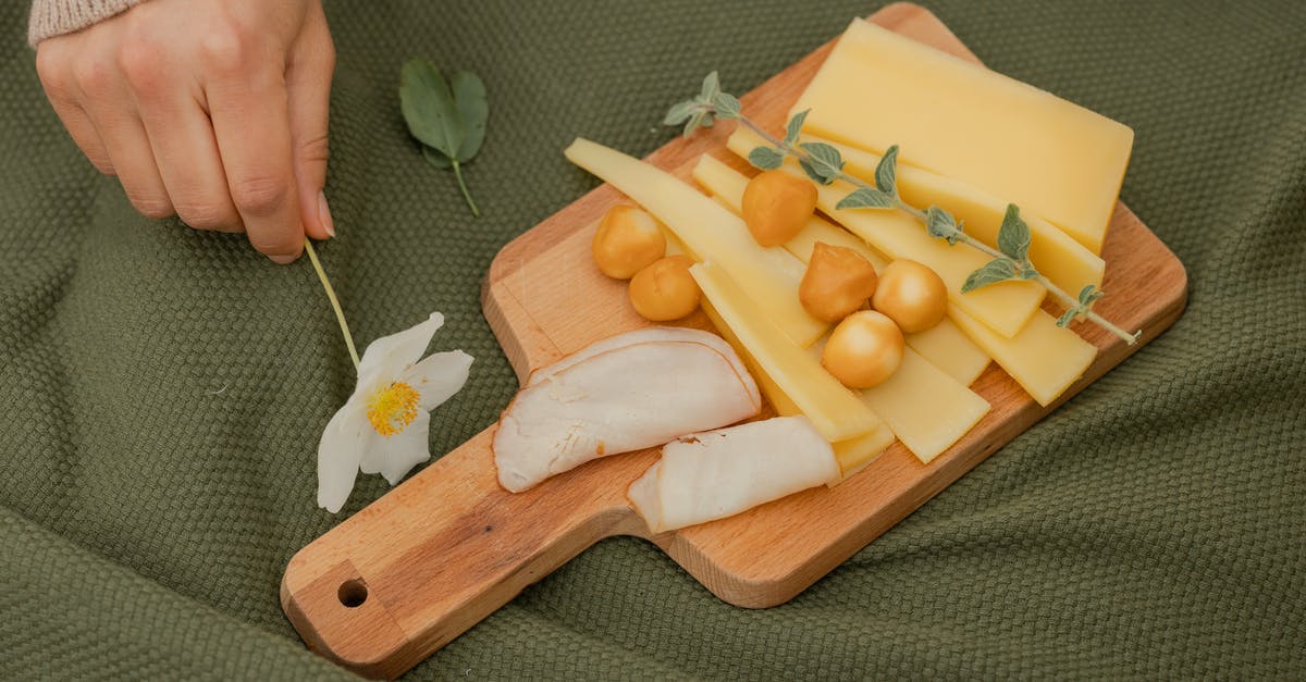 Crumbly cheddar - Sliced Fruits on Brown Wooden Chopping Board