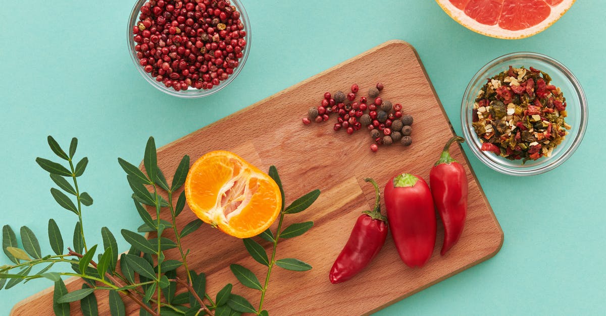 Crunchy/fried grapefruit? - Sliced Lemon Beside Red Chili and Red Chili on Brown Wooden Chopping Board