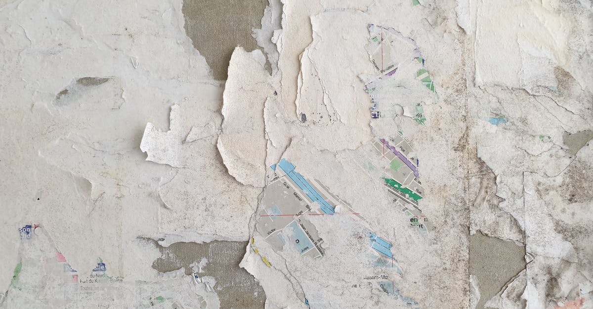 Cupcake Papers Peeling away - White and Blue Paint Brush on Gray Concrete Floor