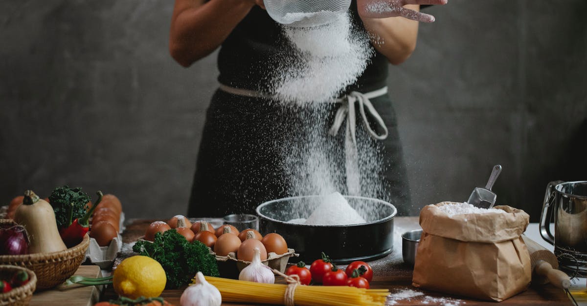 curdling cream in lemon spaghetti - Cook adding flour into baking form while preparing meal