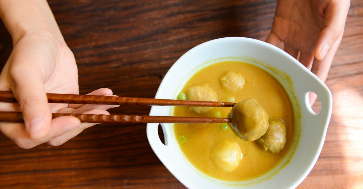 Curried parsnip soup, not flavoursome enough - Person Holding Chopsticks and White Ceramic Bowl