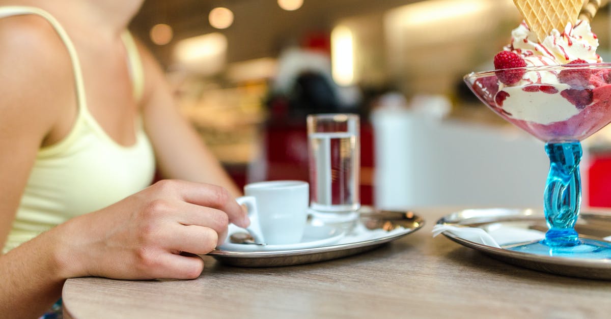 Custard based ice cream vs eggless ice cream - Woman Sitting on Chair in Front of Table