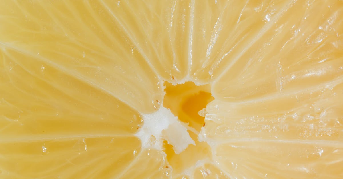 Custard surface has tiny pockmarks when I use fruit pulp - Closeup cross section of lemon with fresh ripe juicy pulp