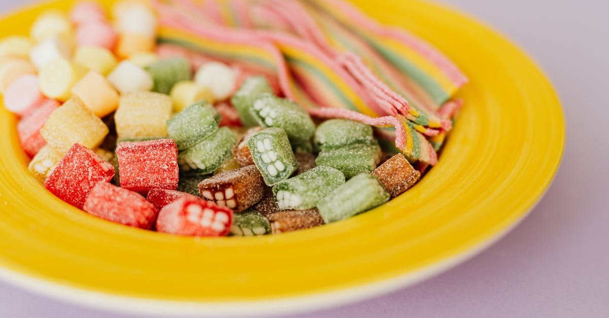 Cutting sugar in savory butternut squash dishes - Tasty colorful gumdrops in plate