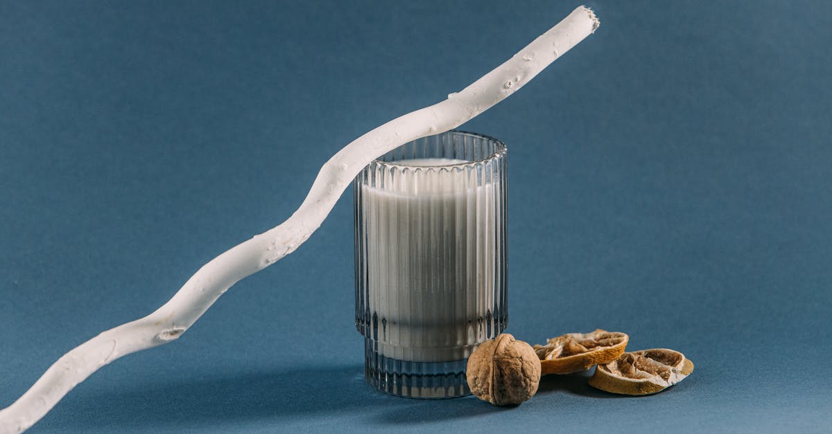 Dairy substitutes for various purposes - White Plastic Rolling Pin on Brown and Black Labeled Bottle