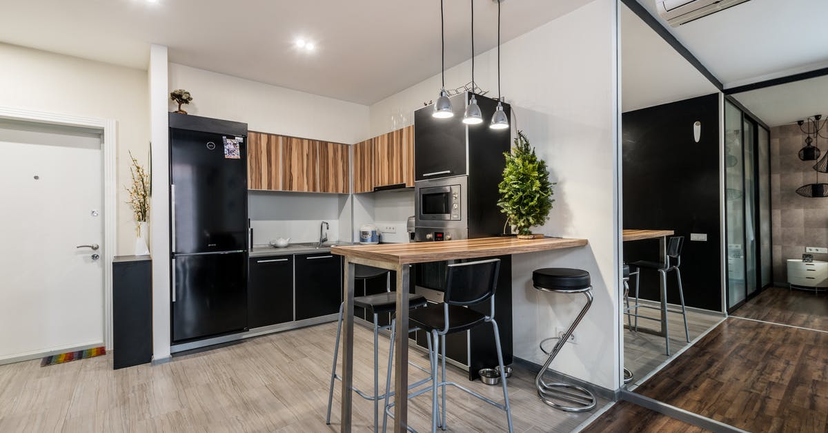 damaged microwave door - Modern kitchen in apartment with table