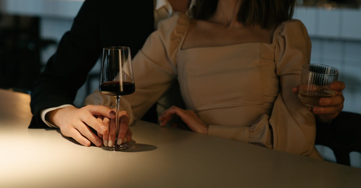 Date bars are too sticky - Woman in Beige Long Sleeve Shirt Holding Wine Glass