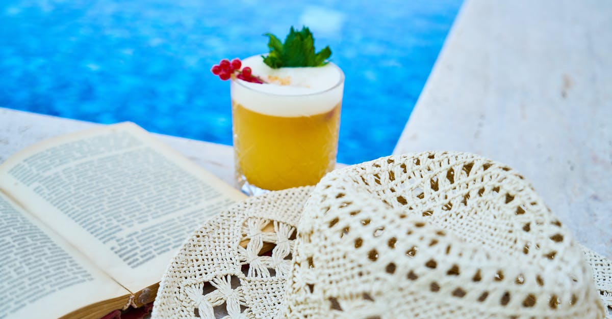 Day 8 of Sourdough Starter, is it still alive? - Clear Drinking Glass With Juice On A Poolside