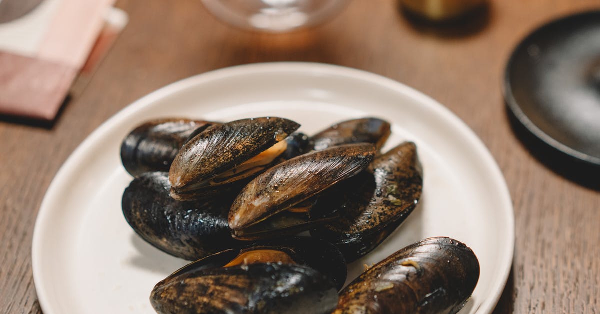 Debeard or purge mussels first? - A Close-Up Shot of Mussels on a Plate