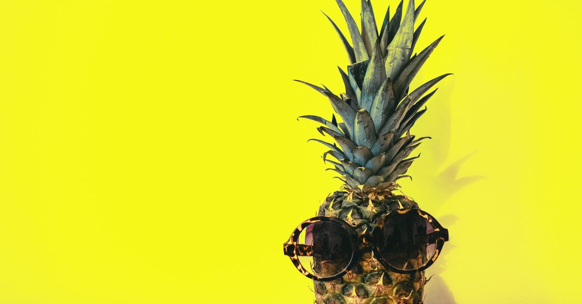 Decoration food long-term preservation - Green Pineapple Fruit With Brown Framed Sunglasses Beside Yellow Surface