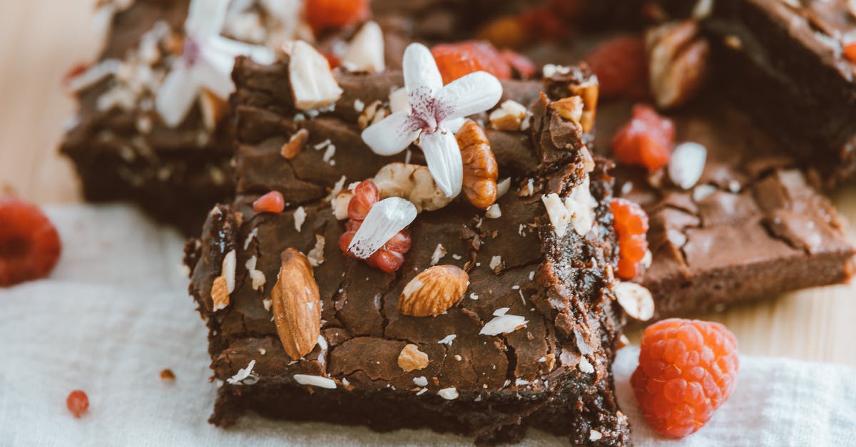 Decrease stickiness of brownies during depanning? - Brown and White Chocolate Cake With White Flower on Top